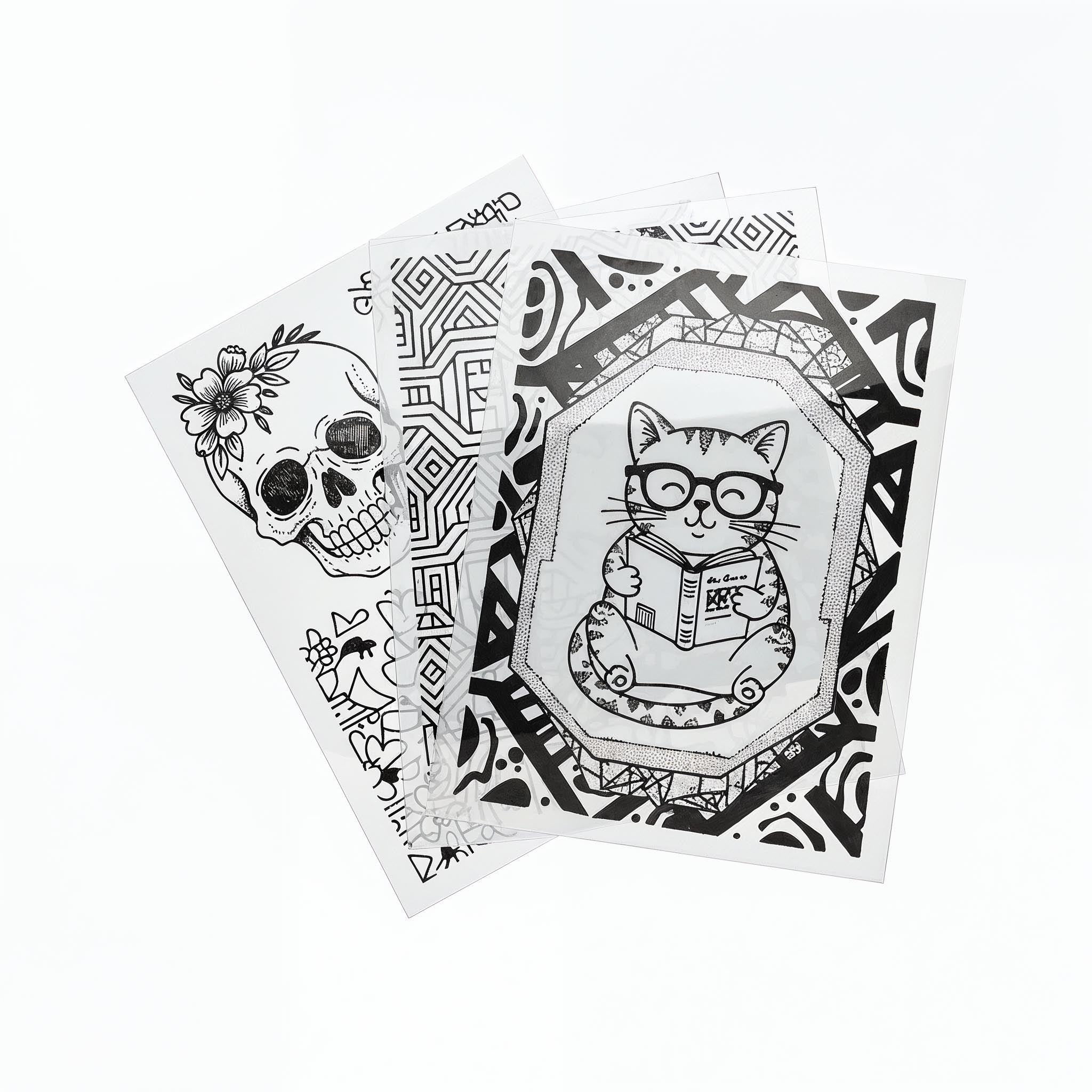 Siebdruckfilme bedruckt mit drei unterschietlichen Motiven (Katze, Muster Totenschädel)